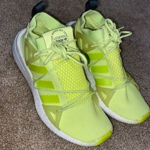 Neon yellow Addidas tennis shoes
